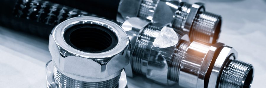 Rubber hoses and tubes with metal fasteners, industrial concept background